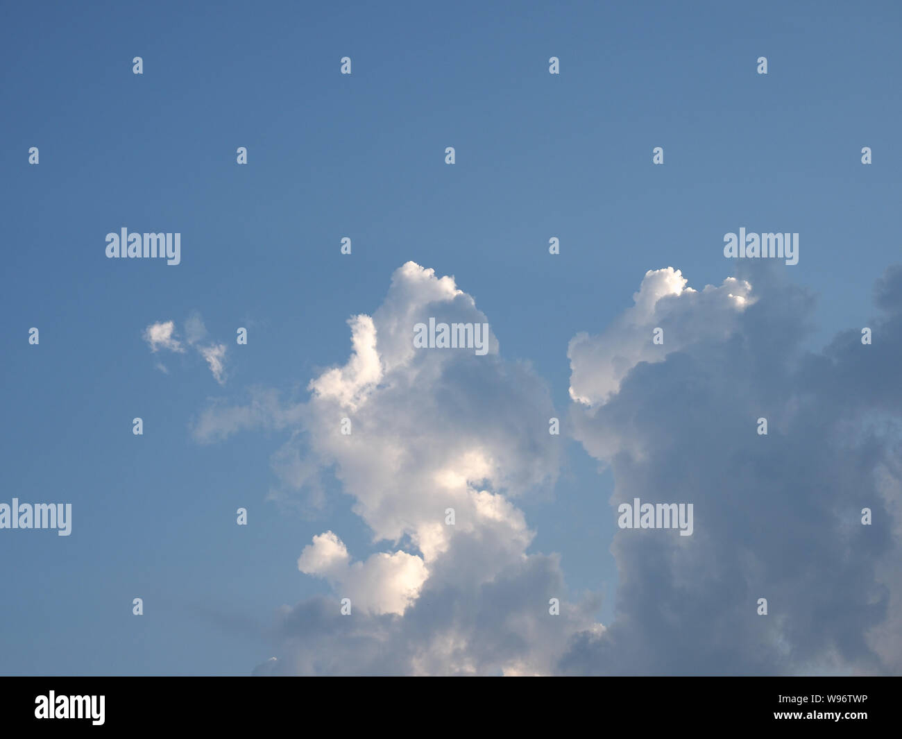 blue sky with clouds useful as a background Stock Photo - Alamy