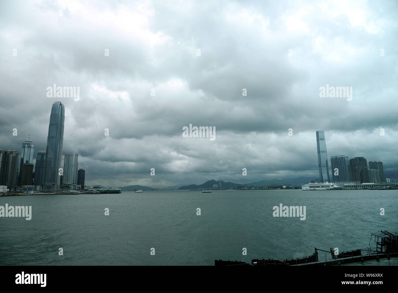 The Victoria Harbour is pictured in heavy rain under clouds caused by Typhoon Vicente in Hong Kong, China, 23 July 2012.   Hong Kong raised its highes Stock Photo
