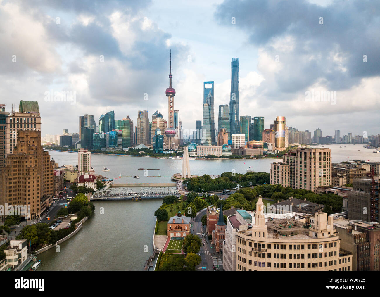 Shanghai skyline aerial view with amazing skyscrapers rising above Haungpu river in China Stock Photo
