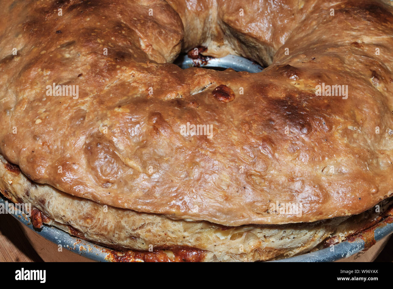 Casatiello, traditional neapolitan easter salty cake with mixed diced cheeses and cured meat Stock Photo