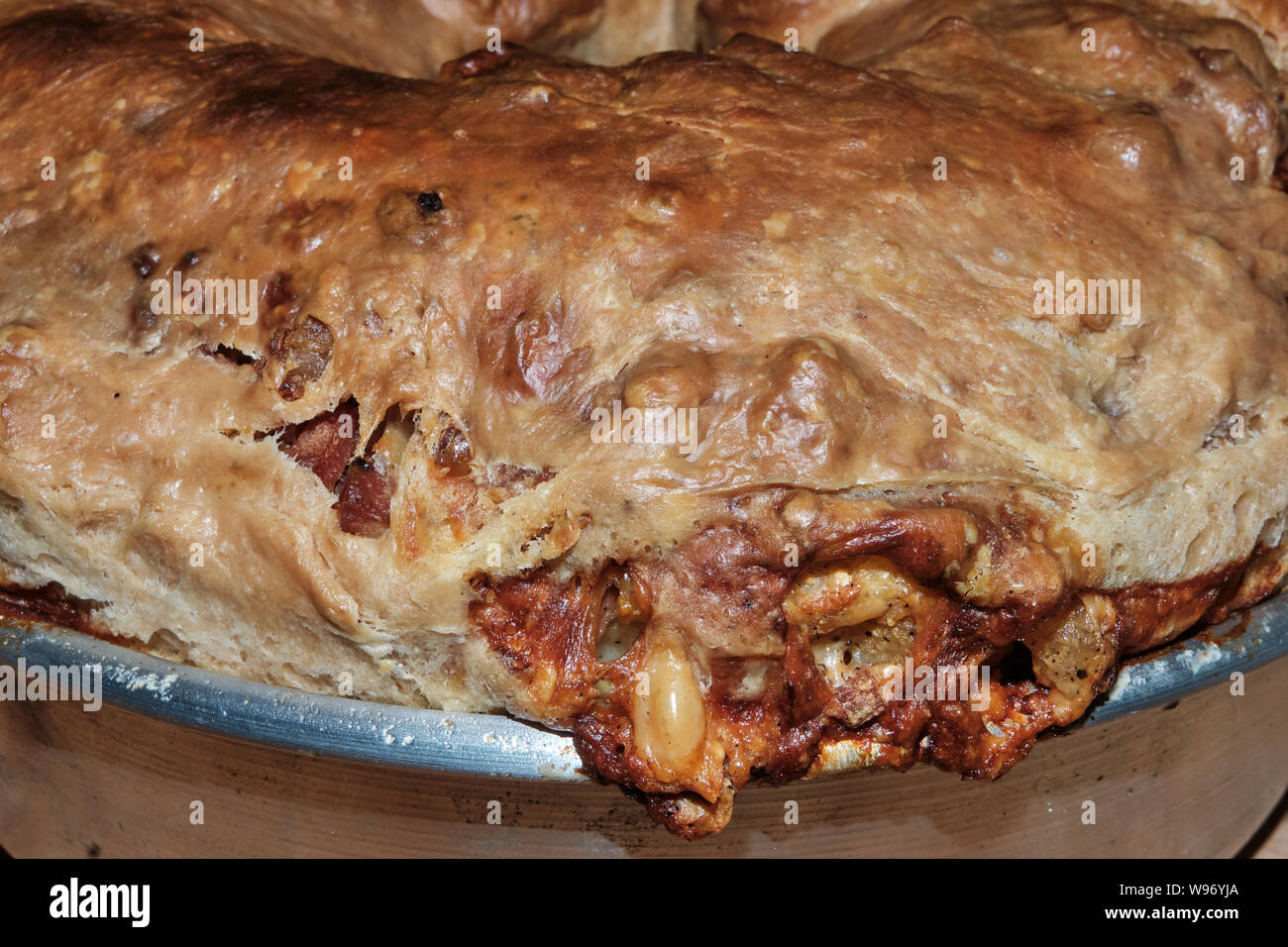 Casatiello, traditional neapolitan easter salty cake with mixed diced cheeses and cured meat Stock Photo