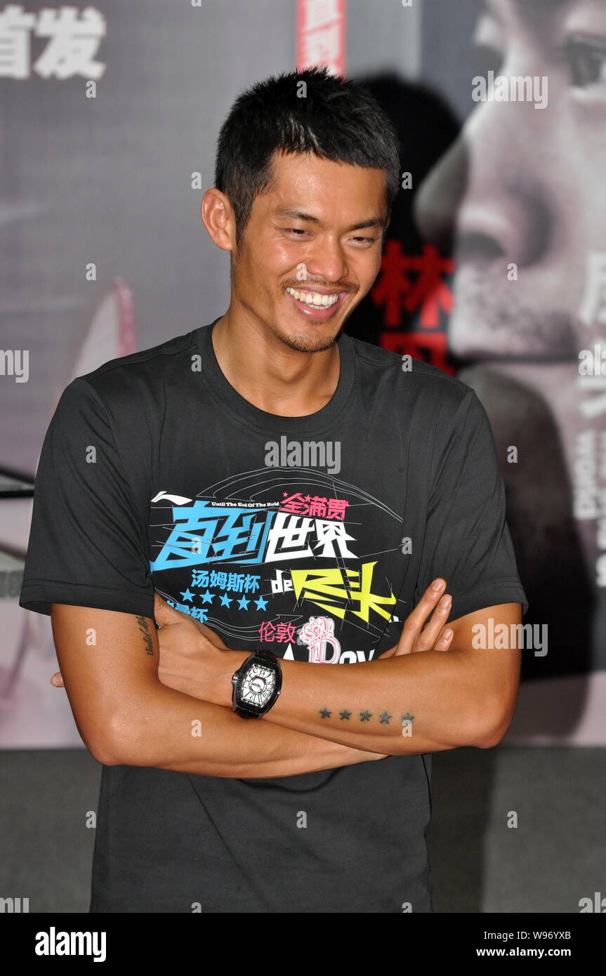 Chinese badminton world champion Lin Dan poses during an event to promote his autobiography, Until The End of The World, in Beijing, China, 12 August Stock Photo