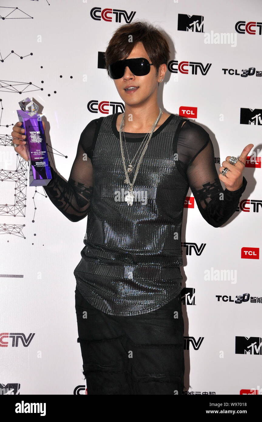 Taiwanese singer and actor Show Lo holds his trophy for the most