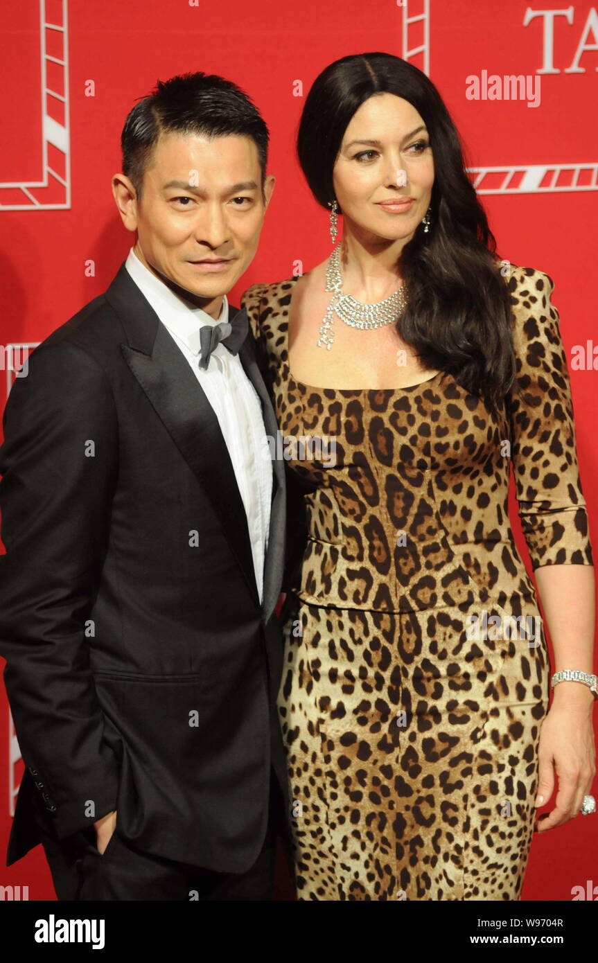 Italian actress Monica Bullucci poses with Hong Kong actor Andy Lau during the Cartier Never Stop Tank new watch releasing activity in Shanghai,  Chin Stock Photo