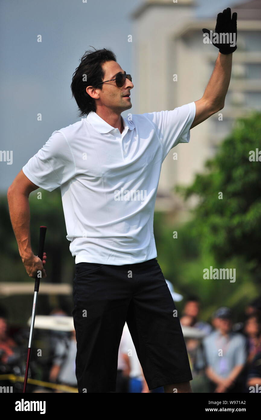 US actor and film producer Adrien Brody gestures during the 2012 Mission Hills World Celebrity Pro-Am golf tournament in Haikou city, south Chinas Hai Stock Photo