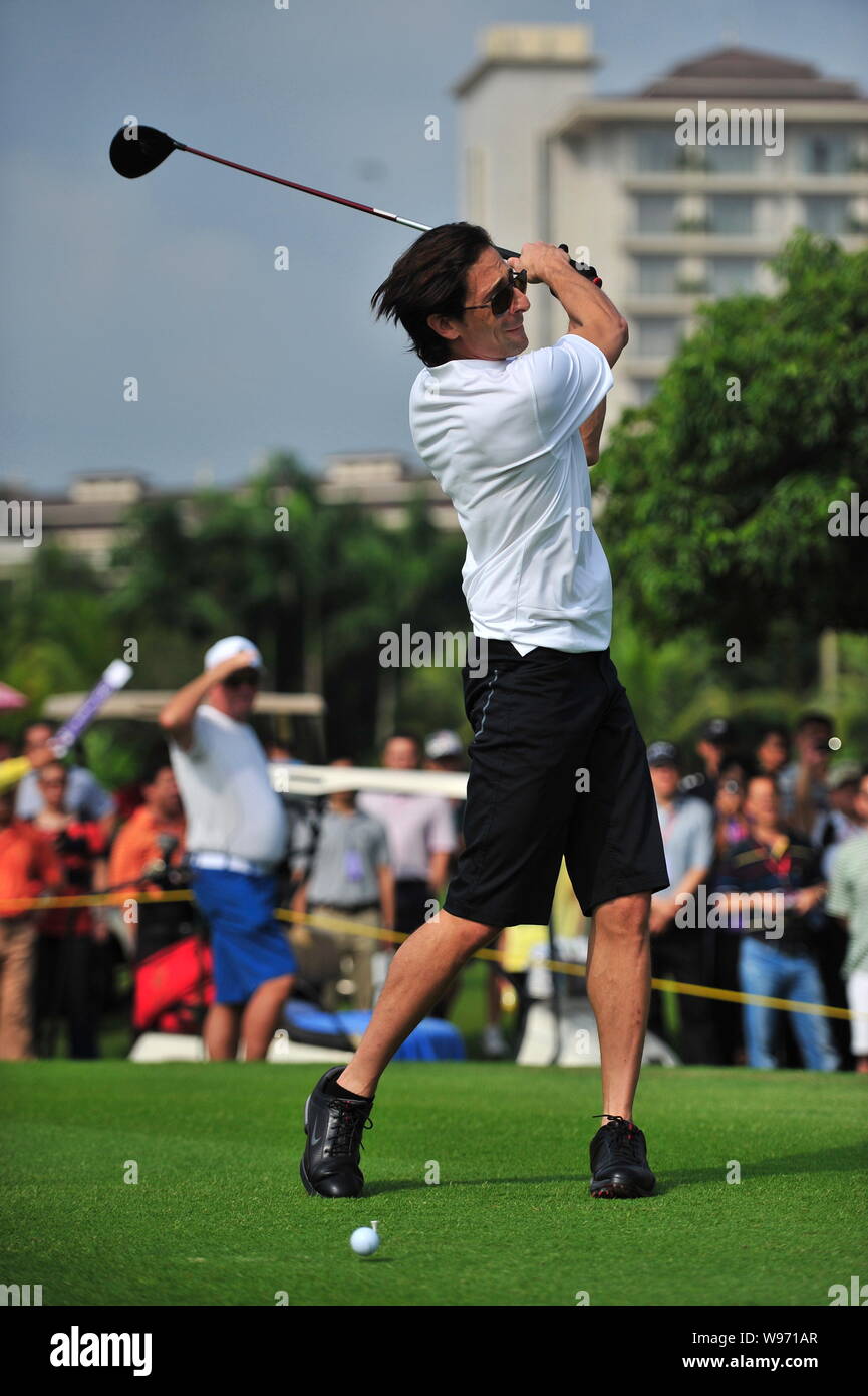 US actor and film producer Adrien Brody plays a shot during the 2012 Mission Hills World Celebrity Pro-Am golf tournament in Haikou city, south Chinas Stock Photo