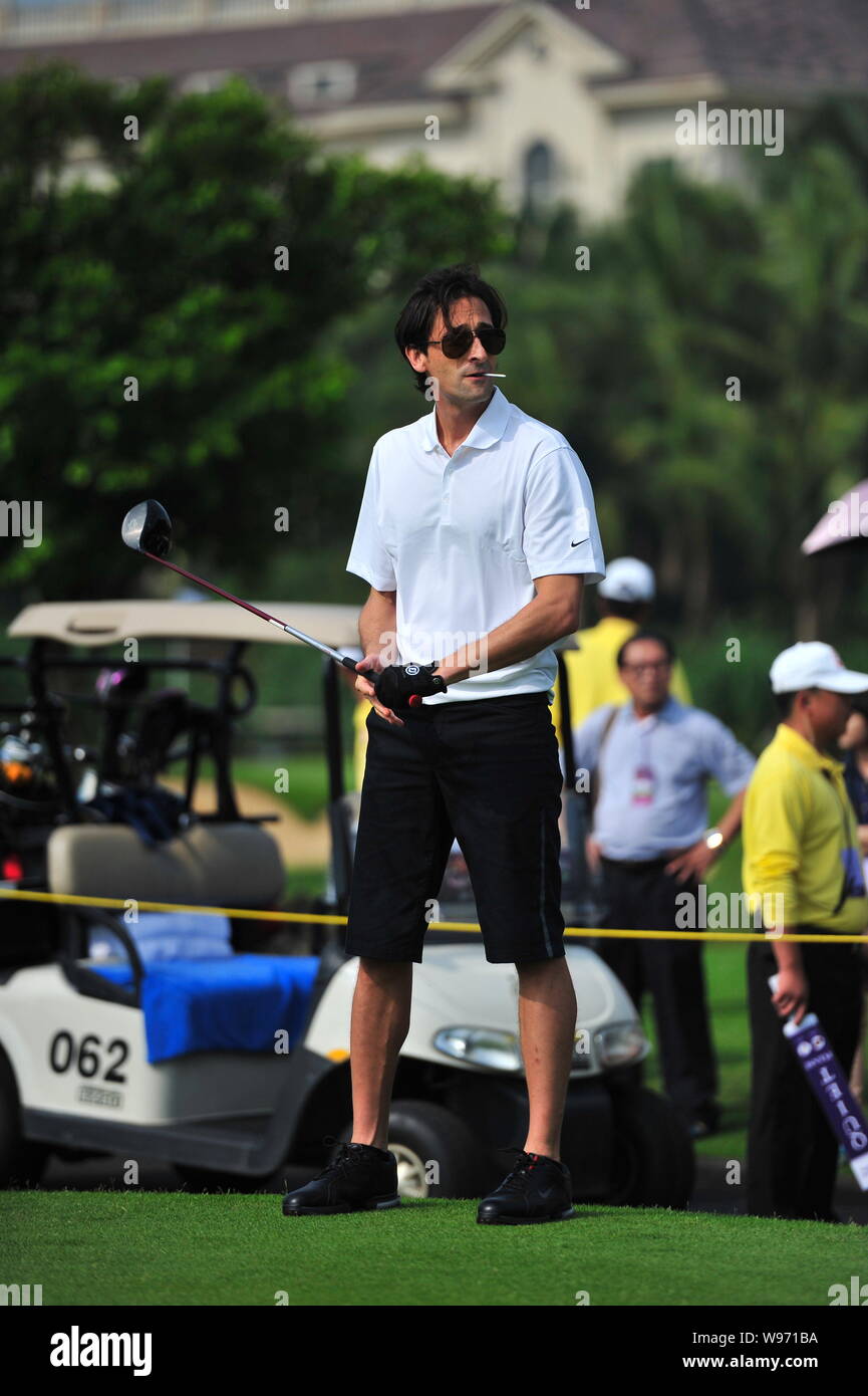 US actor and film producer Adrien Brody looks on during the 2012 Mission Hills World Celebrity Pro-Am golf tournament in Haikou city, south Chinas Hai Stock Photo
