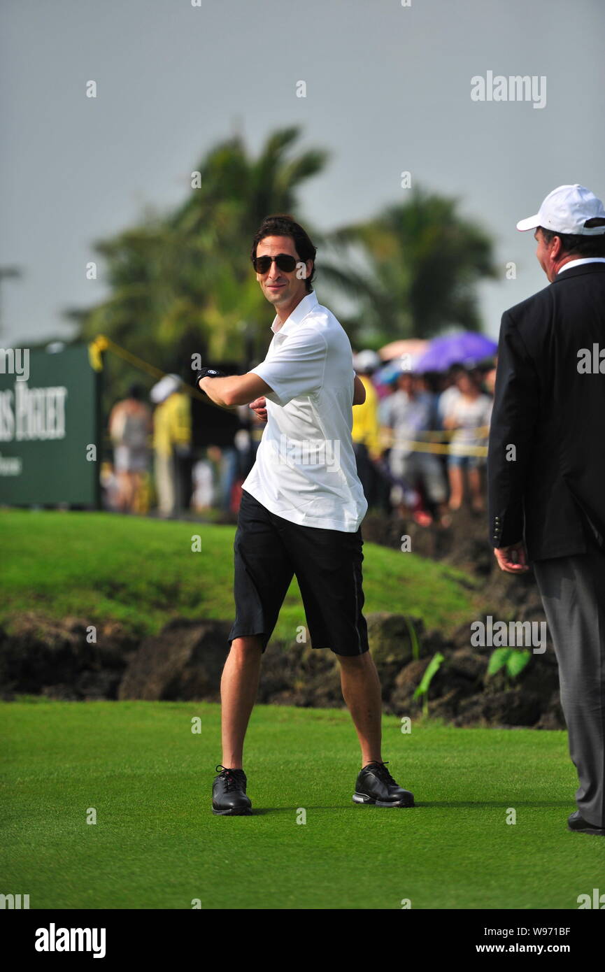 US actor and film producer Adrien Brody warms up during the 2012 Mission Hills World Celebrity Pro-Am golf tournament in Haikou city, south Chinas Hai Stock Photo