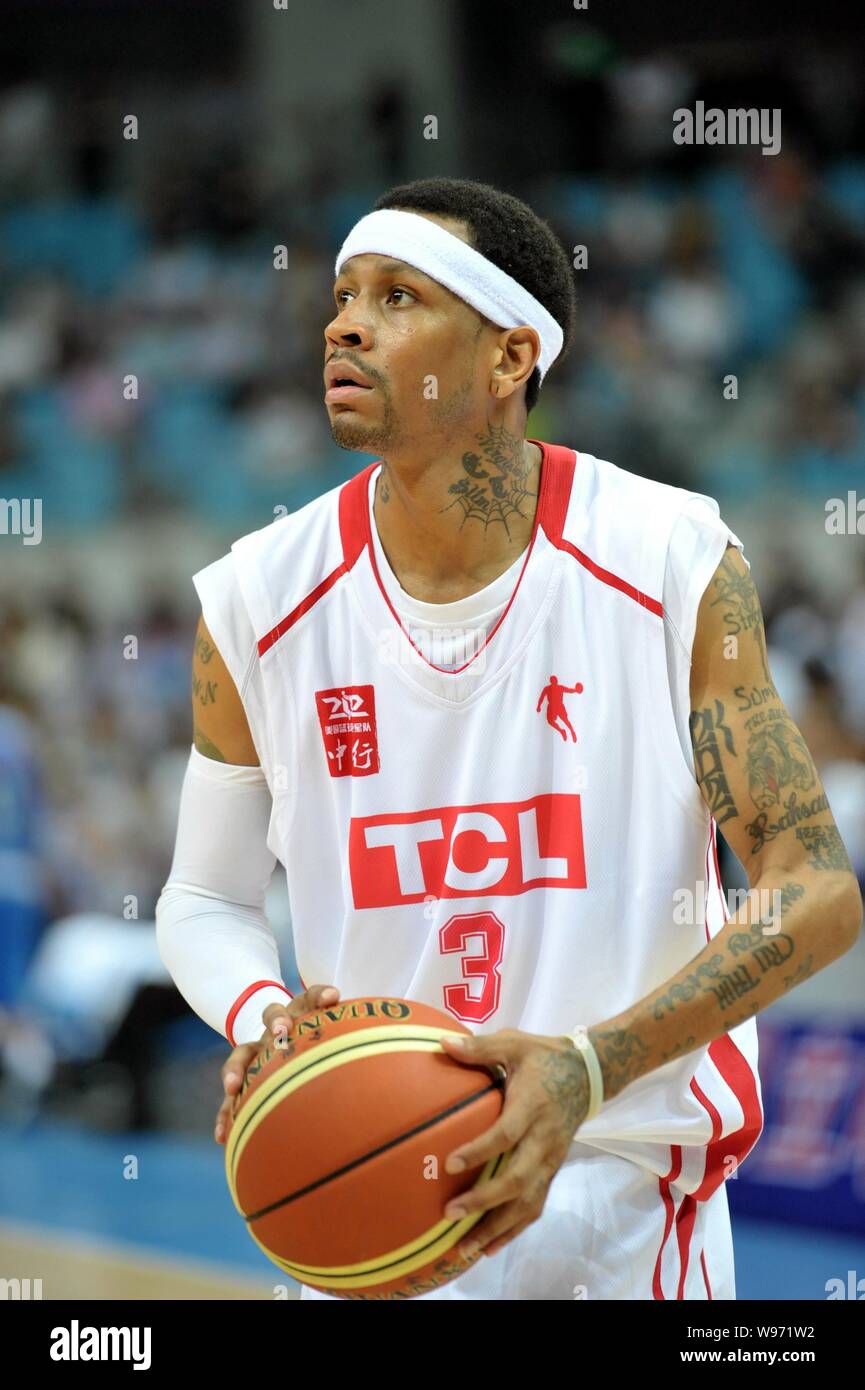 Former NBA star Allen Iverson controls the ball during a friendly