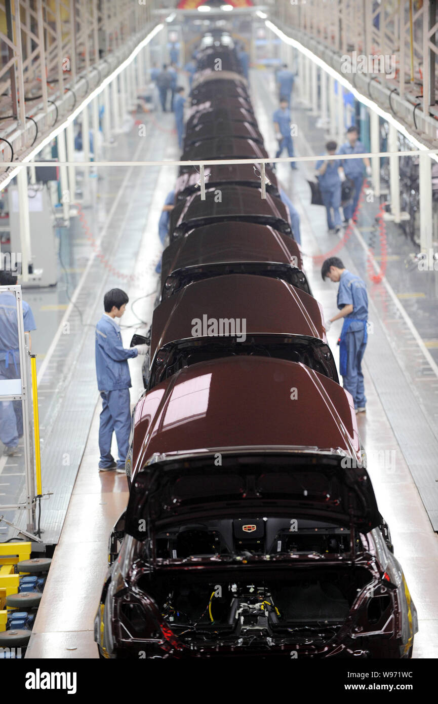 Chinese factory workers assemble Emgrand cars on the assembly line at ...