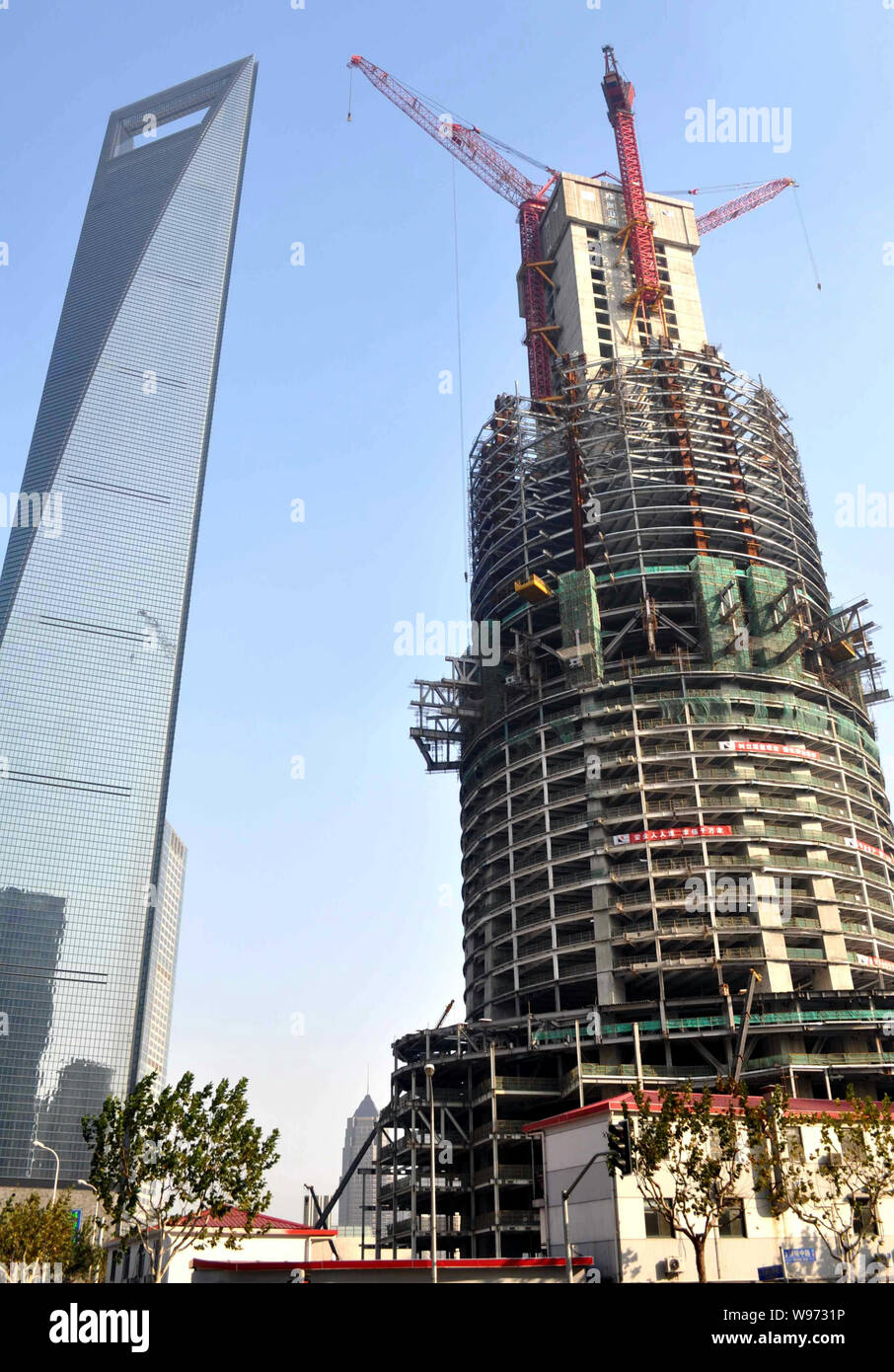 The Shanghai Tower is under construction next to the Shanghai World ...