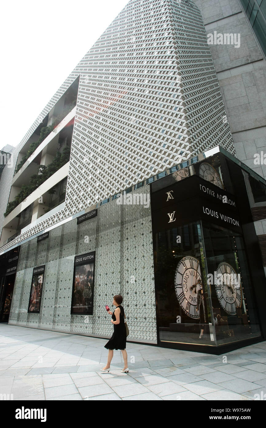 A Pedestrian Walk Past The Louis Vuitton Maison At Hung Lang Square In Shanghai China 18 July 2012 With A Grand Opening The World Famous French F Stock Photo Alamy