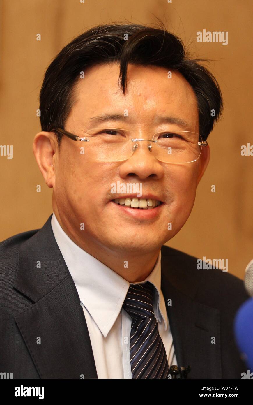 Liang Wengen, Chairman of Sany Group, reacts at an interview during the