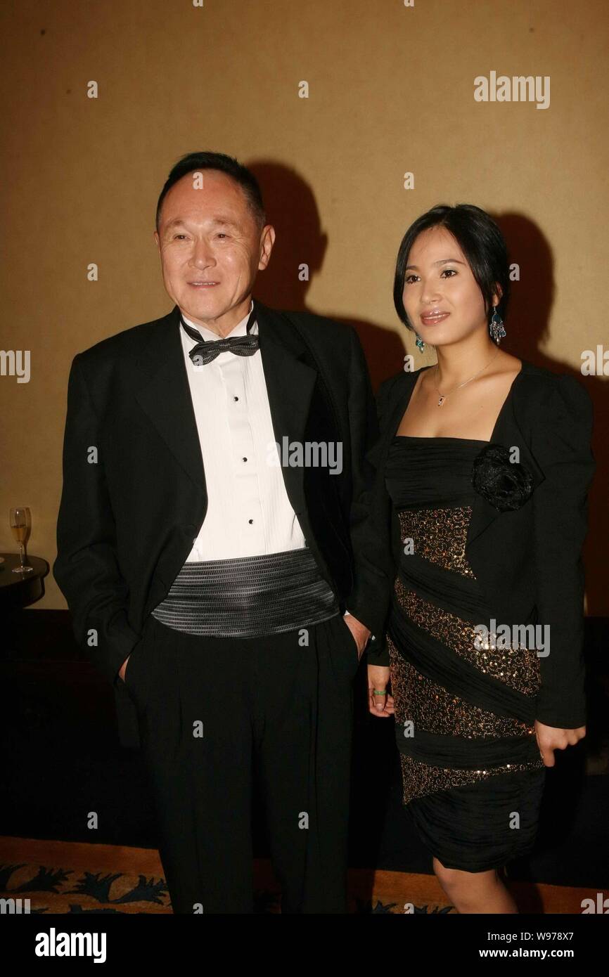 FILE--Hong Kong billionaire property and shipping tycoon Cecil Chao  Sze-tsung, left, poses with his girlfriend Lena (or Leanna) as they arrive  for a Stock Photo - Alamy
