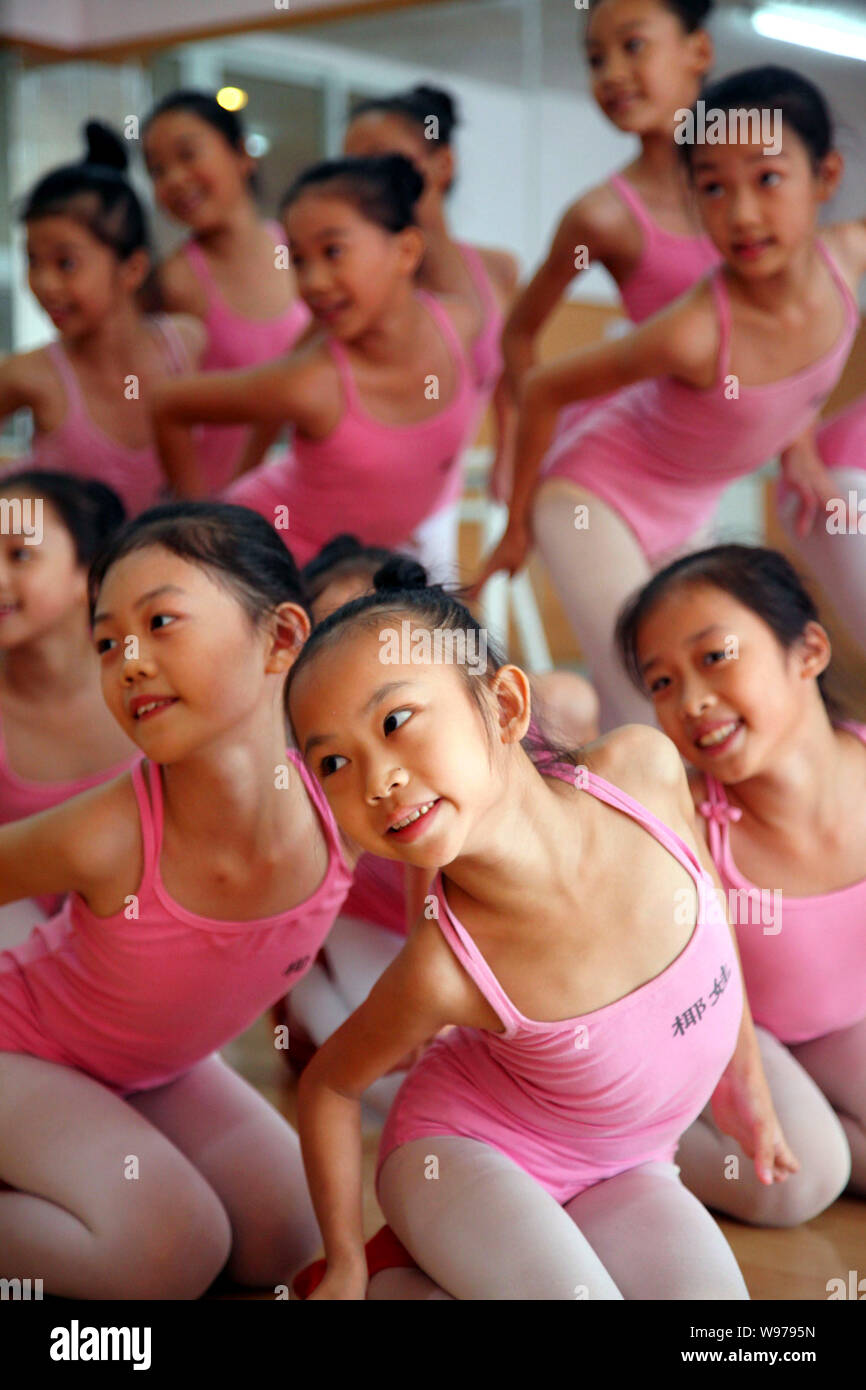Young Chinese girls practice ballet at a dance training center in