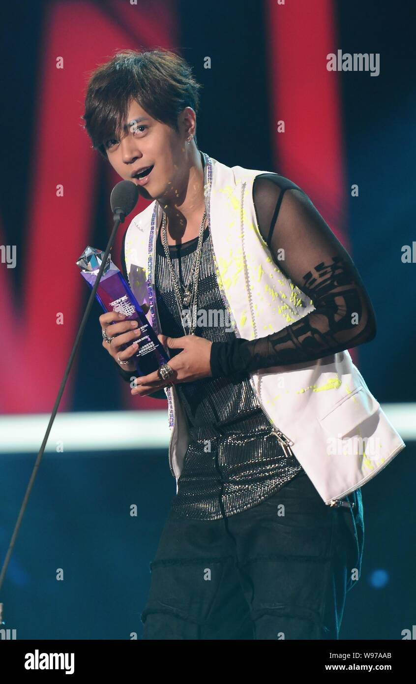 Taiwanese singer and actor Show Lo speaks after being awarded the