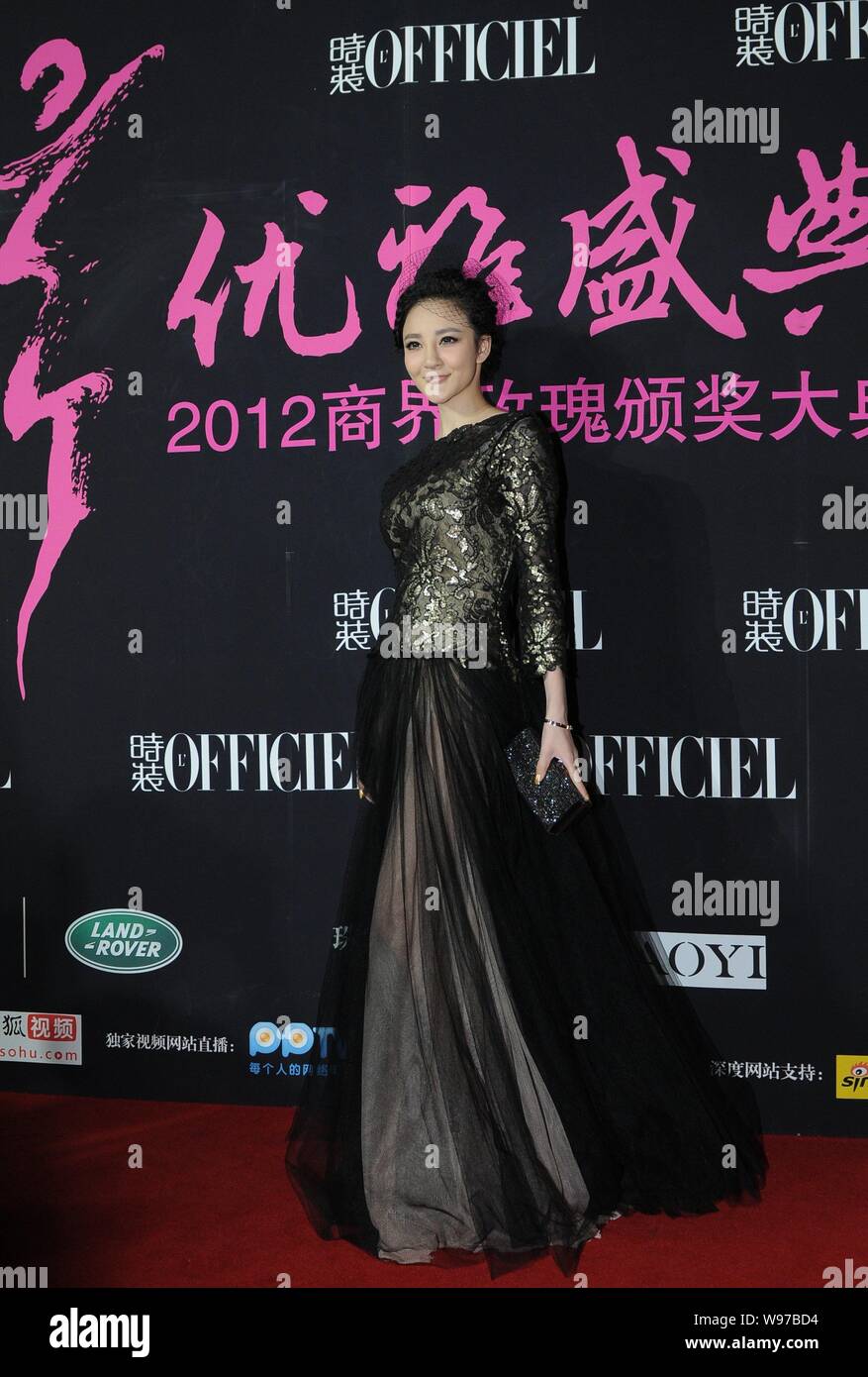 Chinese actress Liu Yuxin poses on the red carpet as she arrives for