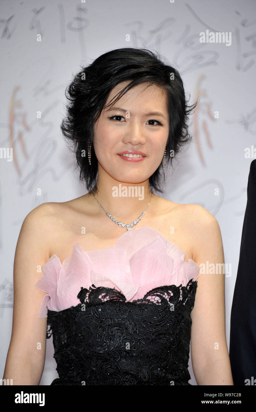Chinese chess prodigy Hou Yifan poses on the red carpet before the 2011 CCTV Sports Personality Award Ceremony in Beijing, China, 15 January 2012. Stock Photo