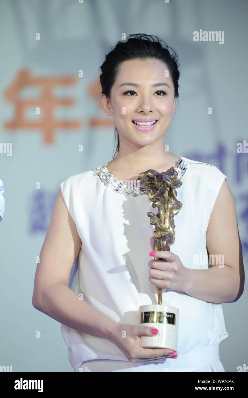 Olympic gymnastic gold medalist Liu Xuan receives award at a promotional event in Beijing, China, 5 September 2012. Stock Photo
