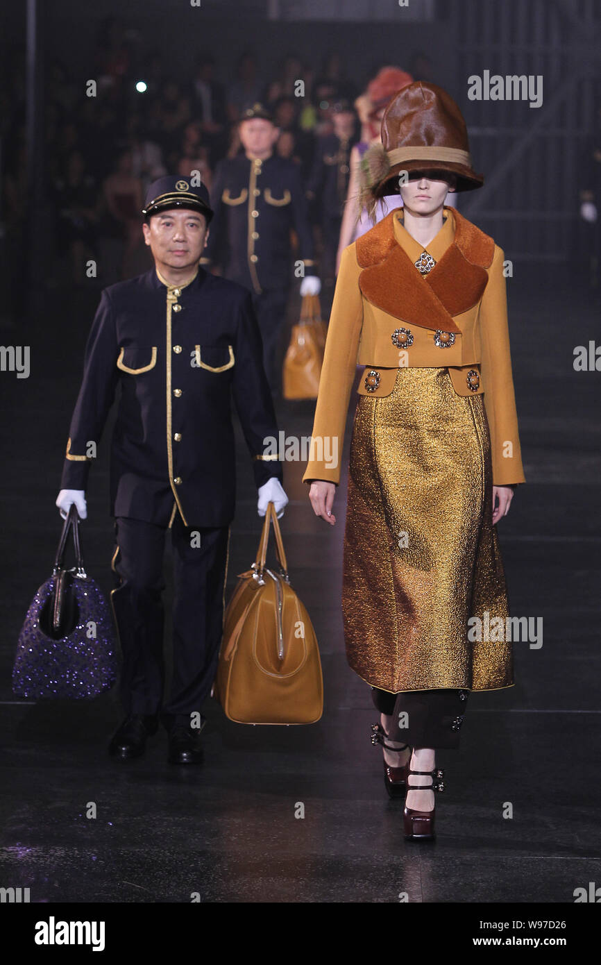 Models display the new collections on the platform during the Louis Vuitton  2012 Autumn/Winter fashion show at the North Bund in Shanghai, China, 19 J  Stock Photo - Alamy