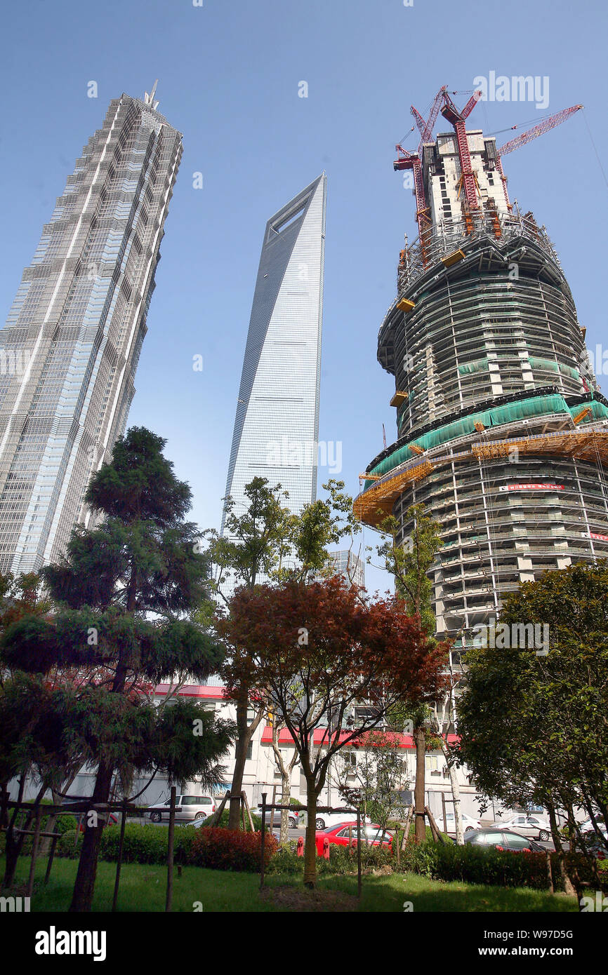 The Shanghai Tower is under construction next to the Shanghai World ...