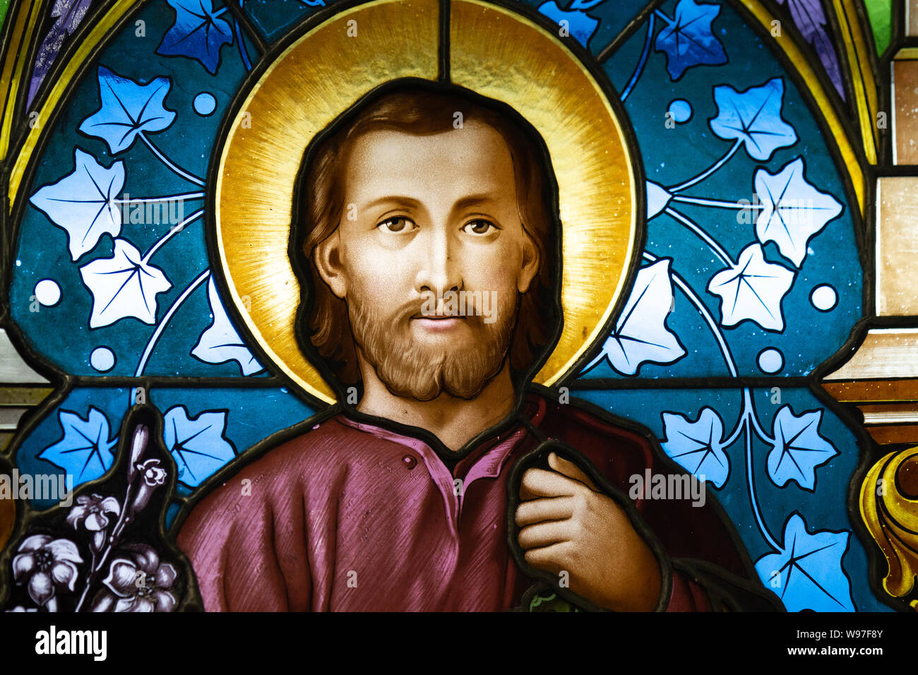 A stained-glass window depicting Saint Joseph. Displayed at the Bishop