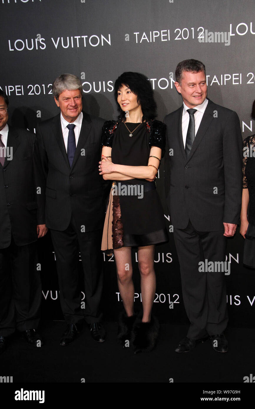 Chinese actress Gong Li, front center, Yves Carcelle, front second left,  Chairman and CEO of Louis Vuitton, Patrick Louis Vuitton, right, a  fifth-gene Stock Photo - Alamy