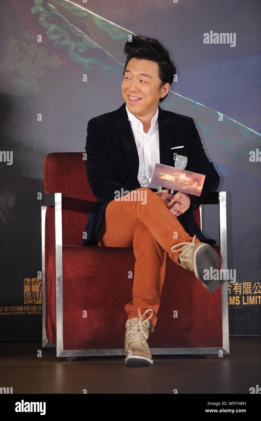 Chinese actor Huang Bo smiles during a press conference for his latest movie, Odyssey, in Beijing, 27 December 2012. Stock Photo