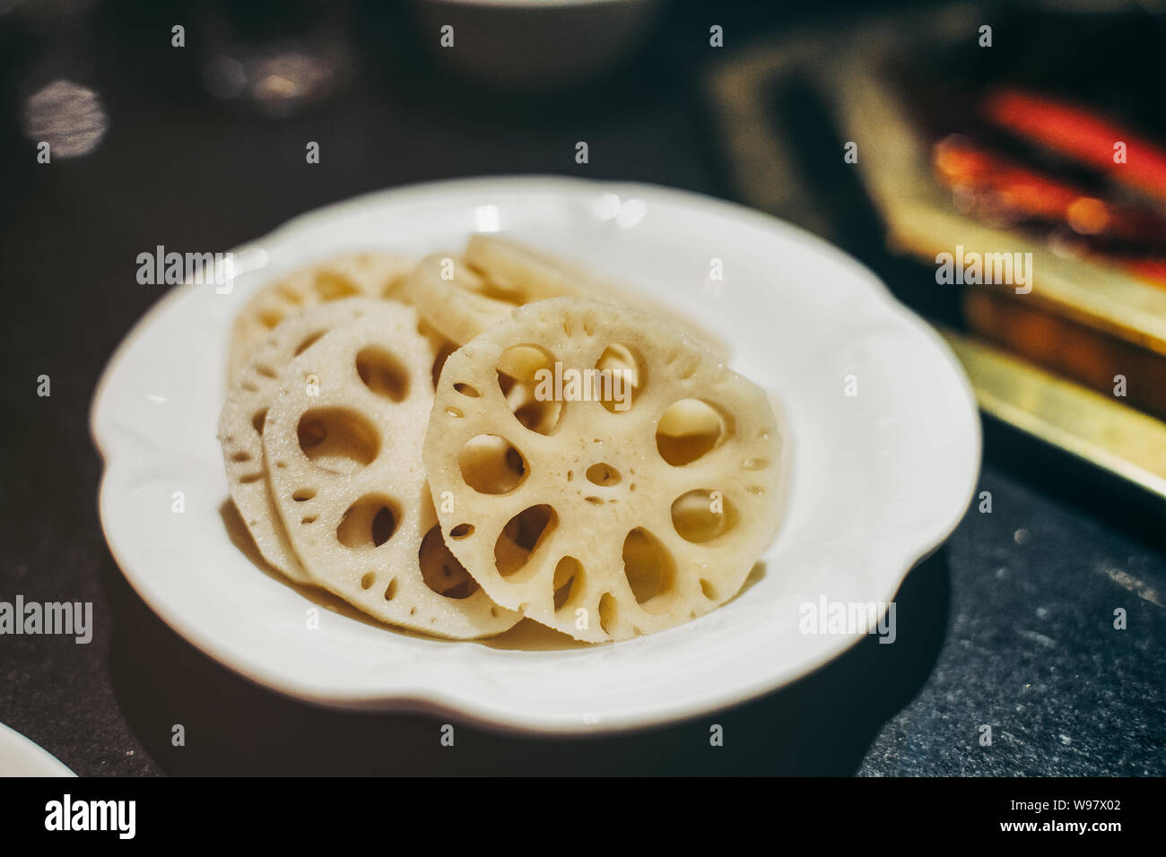 Lotus roots for chinese hot pot, with mala spicy soup Stock Photo