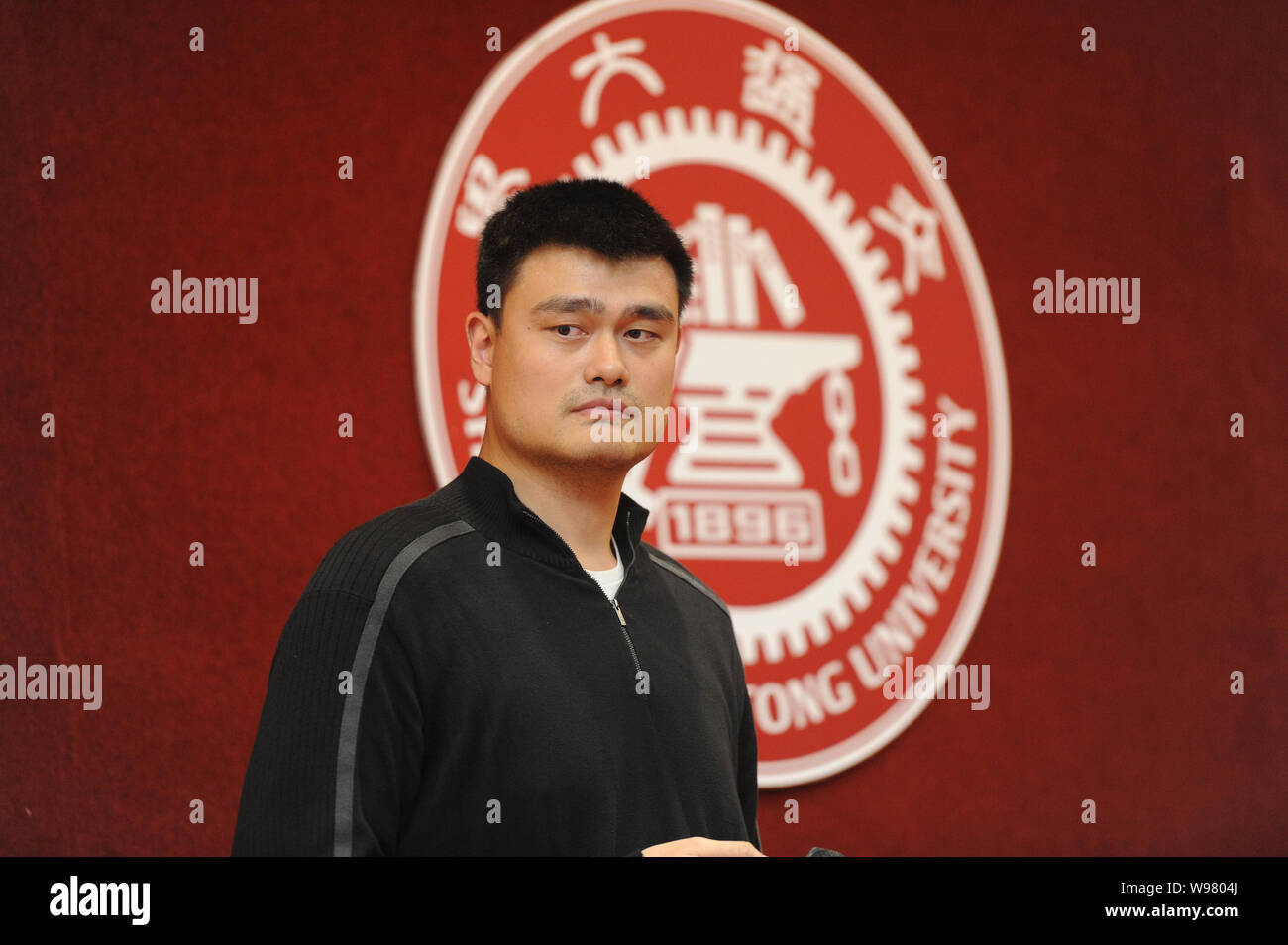 Retired Chinese NBA star Yao Ming is pictured during a press conference for his entrance to school in Shanghai Jiao Tong University in Shanghai, China Stock Photo
