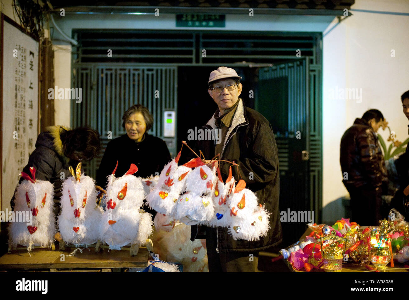 Chinese venders sell rabbit lanterns during the Lantern Festival celebration at the City God Temple (Chenghuang Miao) in Shanghai, China, February 17, Stock Photo
