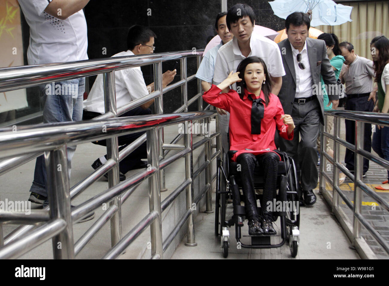 Chinese paralyzed gymnast Sang Lan visits a local disabled persons federation in XiAn city