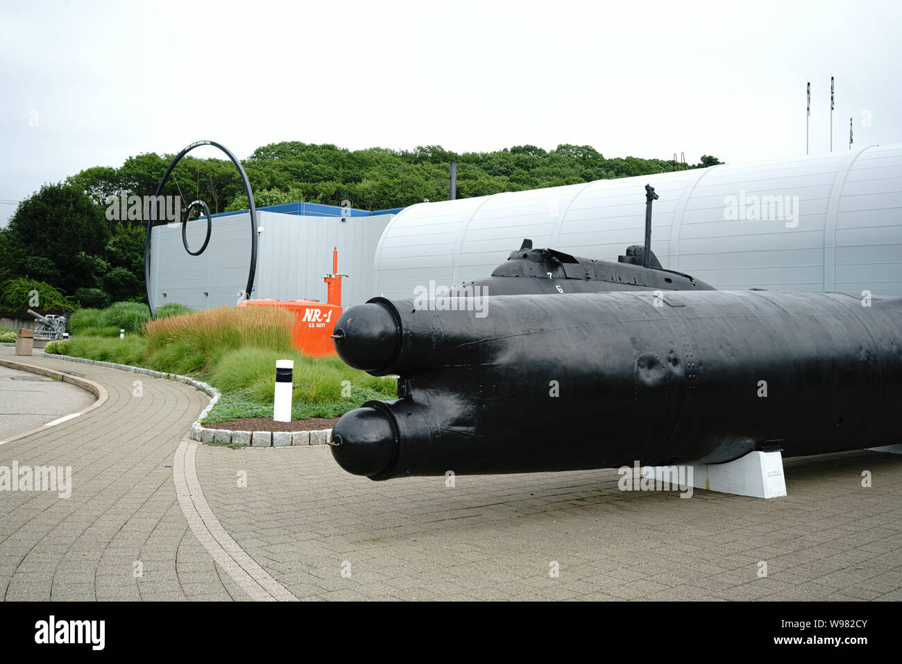 Submarine Force Museum Groton Connecticut. Orange portion of deepwater NR-1 research sub. Black Japanese Type A two man mini sub  See additional info. Stock Photo