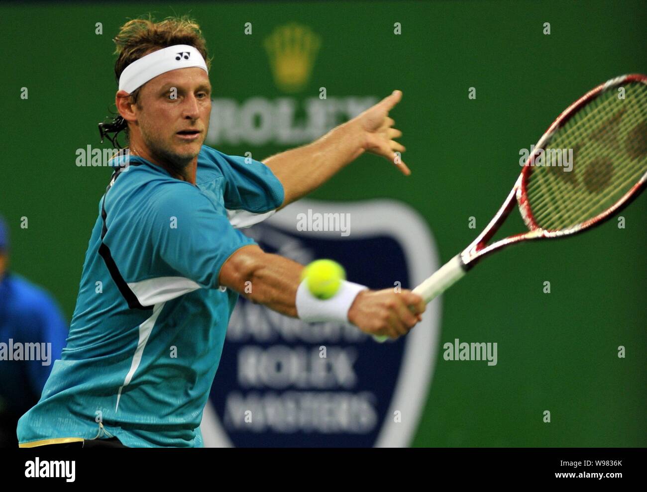 David Nalbandian of Argentina returns a shot against Florian Mayer of Germany during their first round match at the 2011 Shanghai Rolex Masters tourna Stock Photo