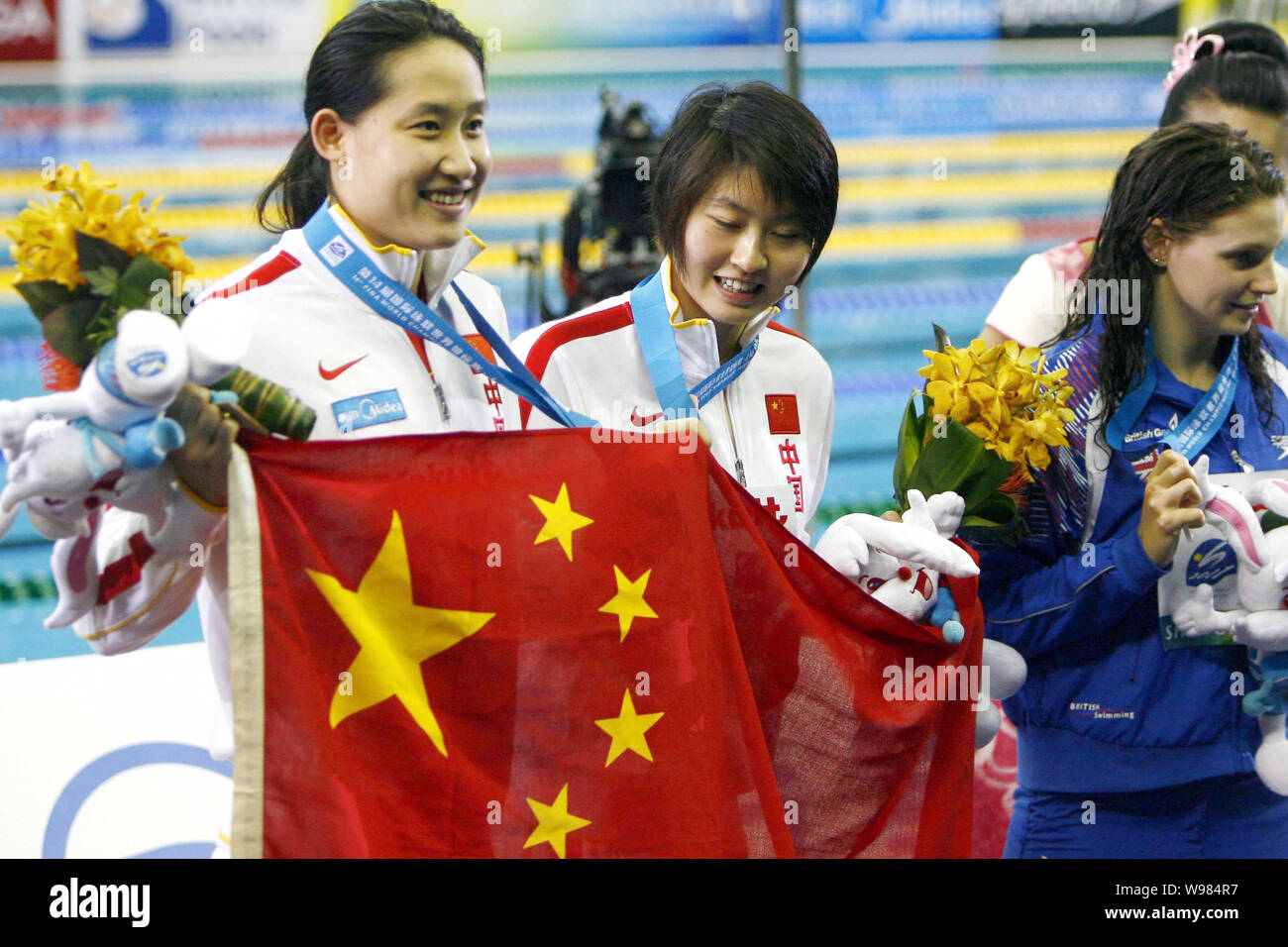 (From left) Bronze medalist Liu Zige, gold medalist Jiao Liuyang of China and silver medalist Ellen Gandy of Britain pose after the award ceremony for Stock Photo
