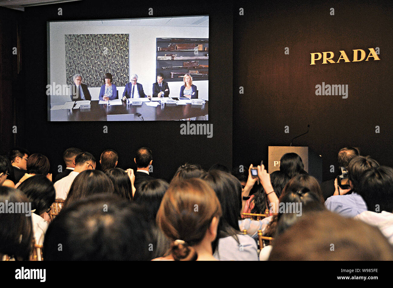 Carlo Mazzi, deputy chairman (L), unidentified translator (2nd L), Patrizio  Bertelli, CEO (C), Armando Tollmelli group controlling director (2nd R) an  Stock Photo - Alamy