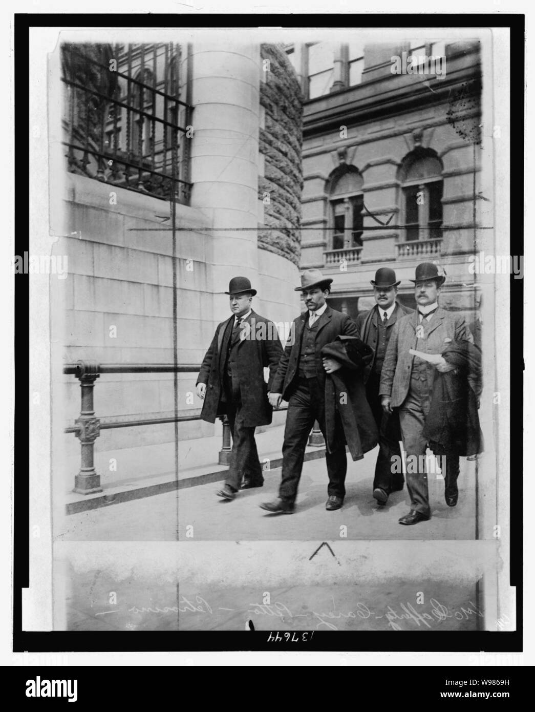 Detective Lt. Joseph Petrosiino( left) , Inspector Carey and Inspector McCafferty escorting Mafia hitman Petto the Ox (Tomasso Petto, second from left) Stock Photo