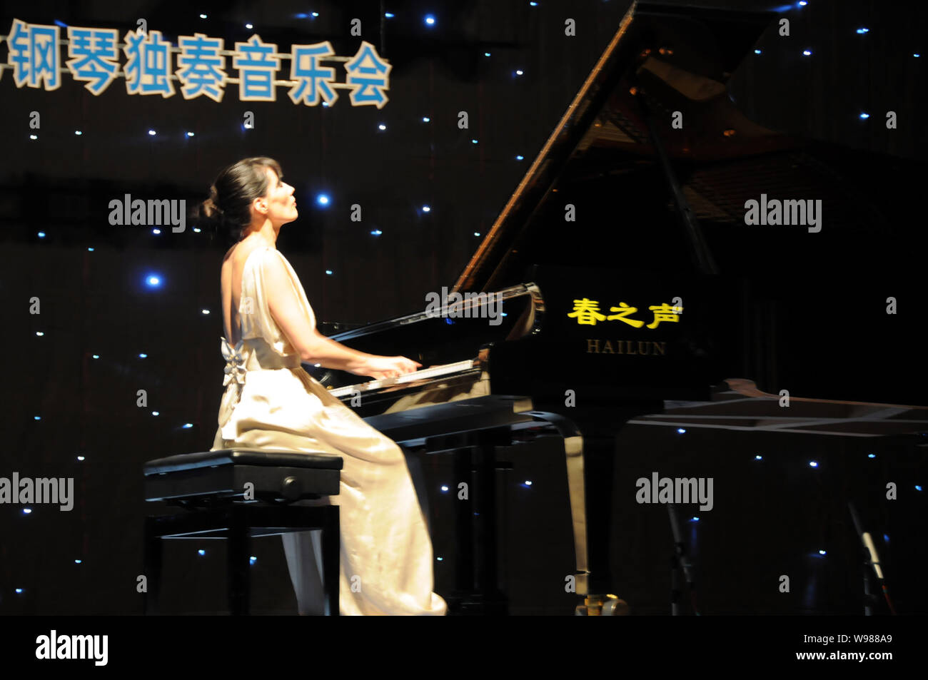 Kim Barbie, a well-known pianist from France, entertains piano fans with  her solo performance at the Great Hall of the People in Haikou, south  Chinas Stock Photo - Alamy