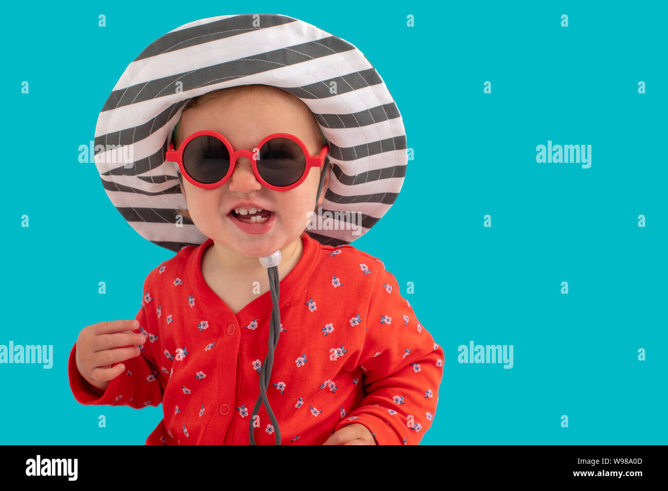 Funny little kid in hat and sunglasses Stock Photo