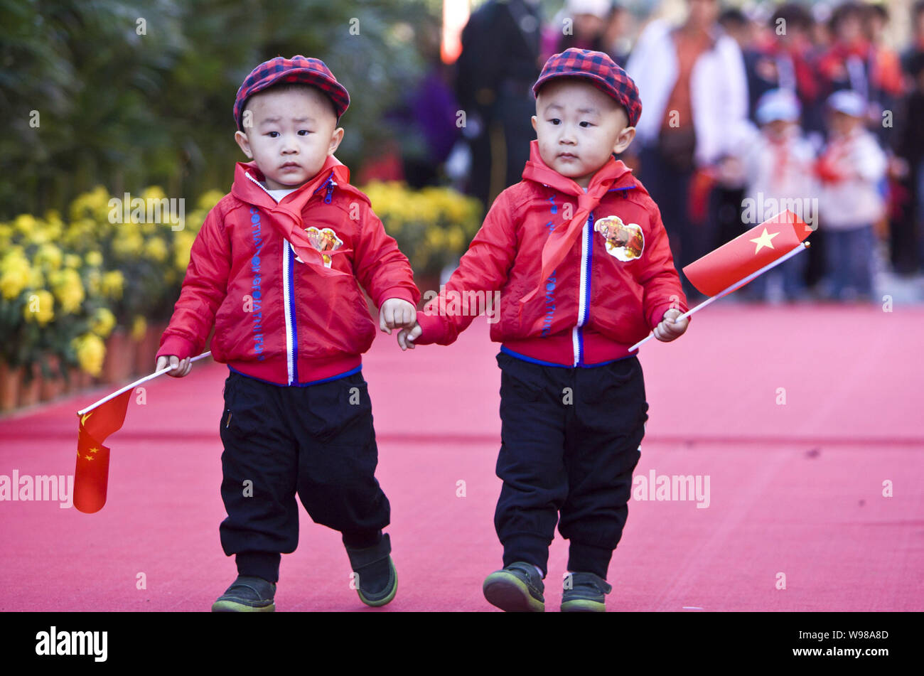 A pair of little Chinese twins attend the 8th Beijing Twins Cultural ...