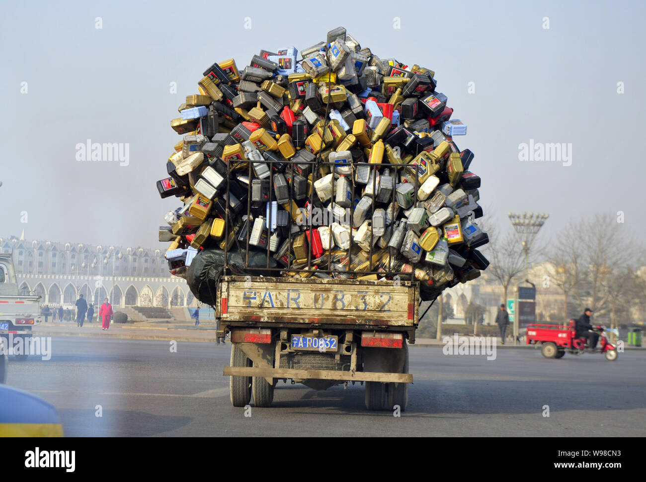 Truck overloaded with plastic containers - Stock Image - C047/7908 -  Science Photo Library