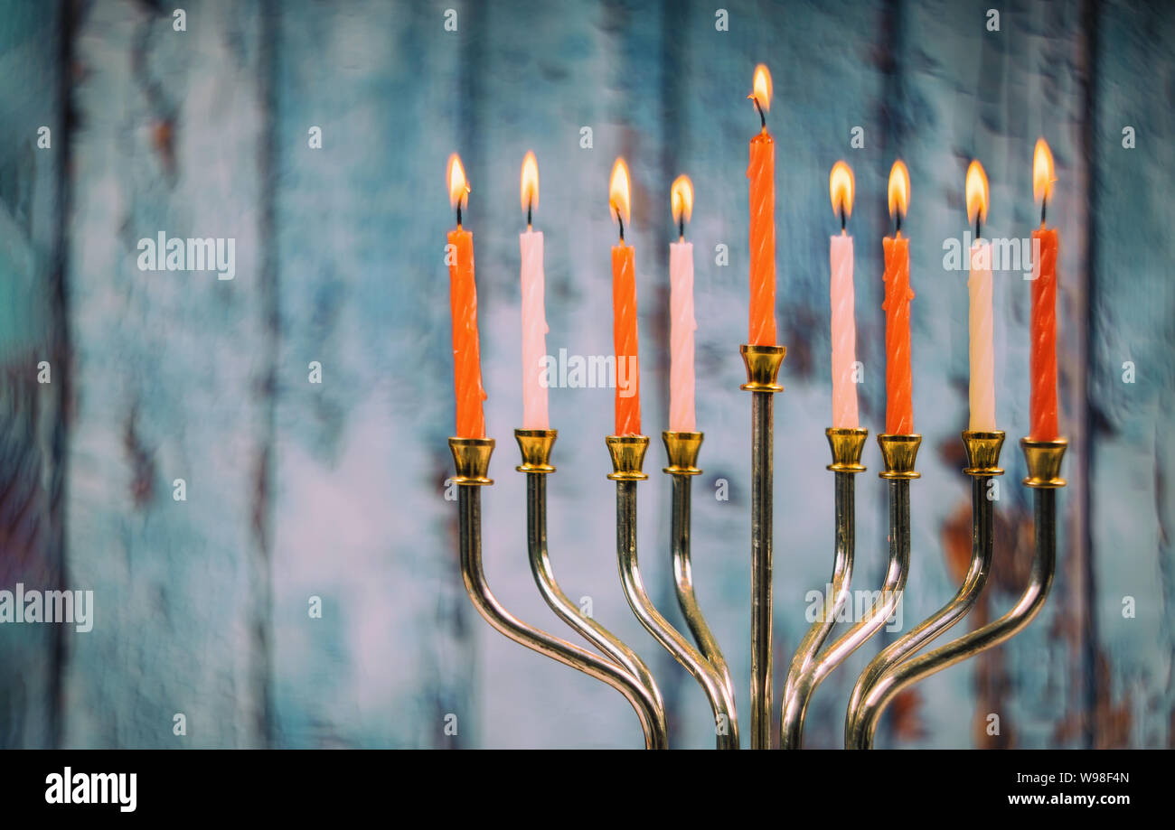 Colorful candles from a burning hanukkah candles in a menorah Stock