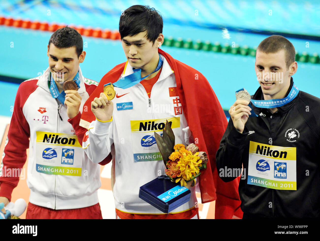 (From left) Bronze medalist Gergo Kis of Hungary, gold medalist Sun Yang of China and silver medalist Ryan Cochrane of Canada show their medals after Stock Photo