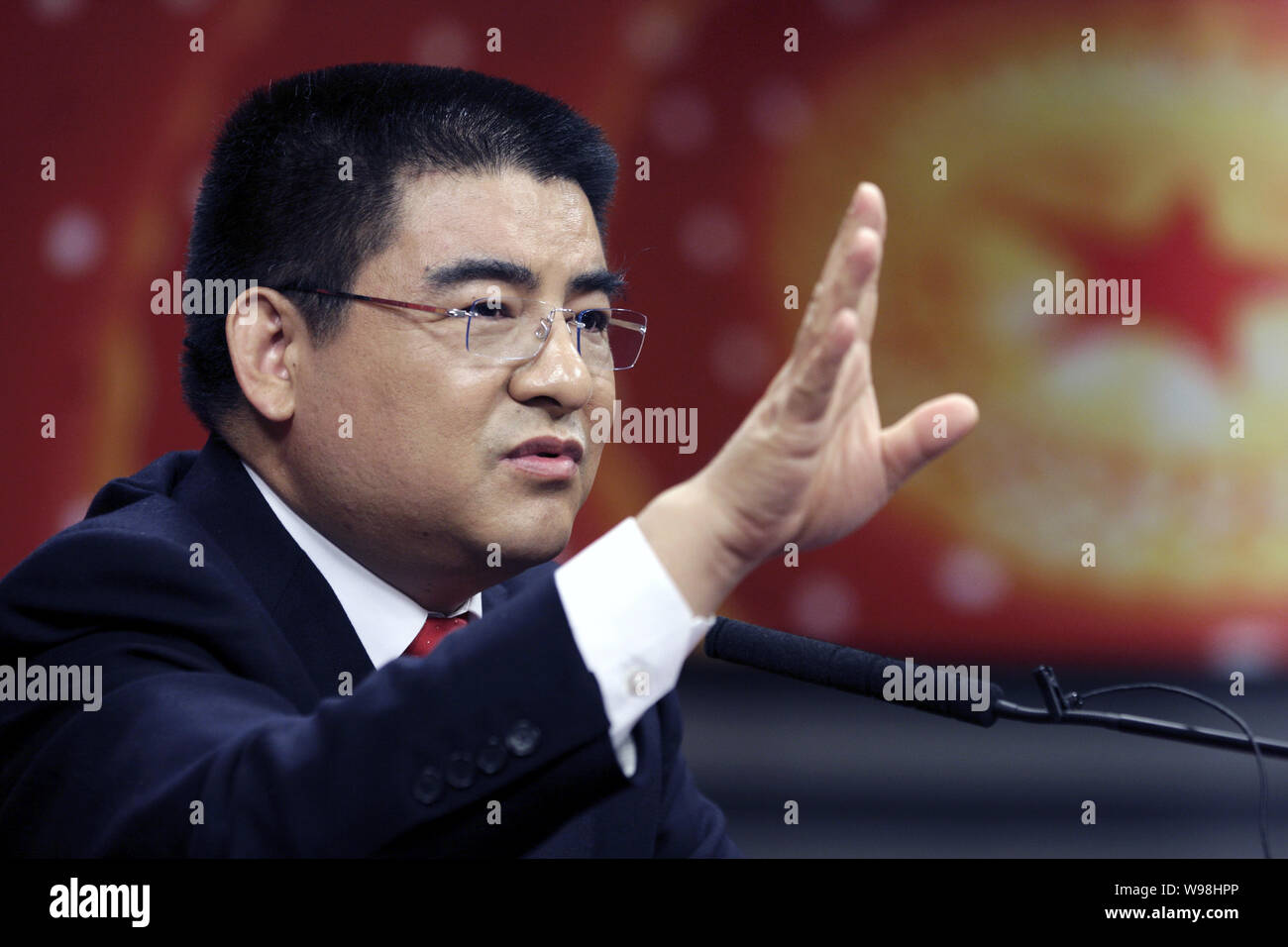 Chinese Mainland philanthropist Chen Guangbiao speaks at an interview in Beijing, China, March 7, 2011.   One of Chinas wealthiest men is jumping to J Stock Photo