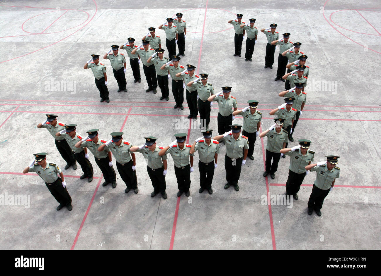 Chinese paramilitary policemen line up to form the emblem of the Communist Party of China (CPC) in Ruian city, east Chinas Zhejiang province, 27 June Stock Photo