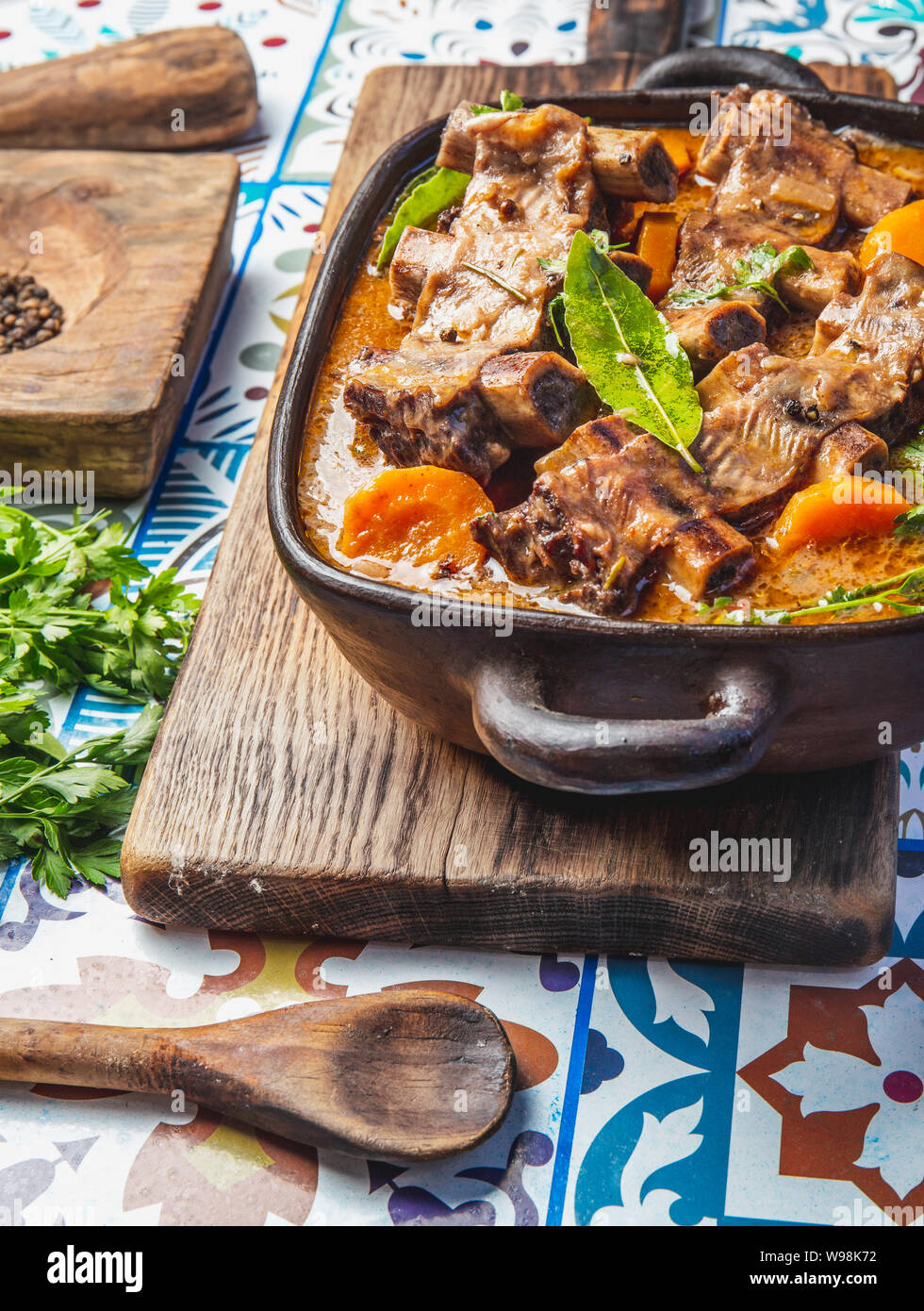 Bourguignon beef ribs stewed with onion, carrot in red wine Stock Photo