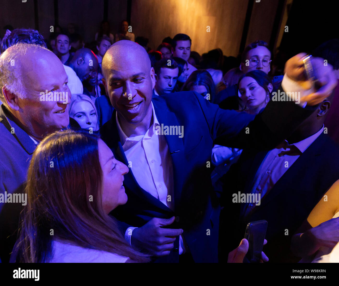 New York, NY - August 12, 2019: Democratic presidential candidate US Senator Cory Booker poses for photos with supporters at campaign grassroots Happy Hour fundraiser event at the nightclub Slate Stock Photo