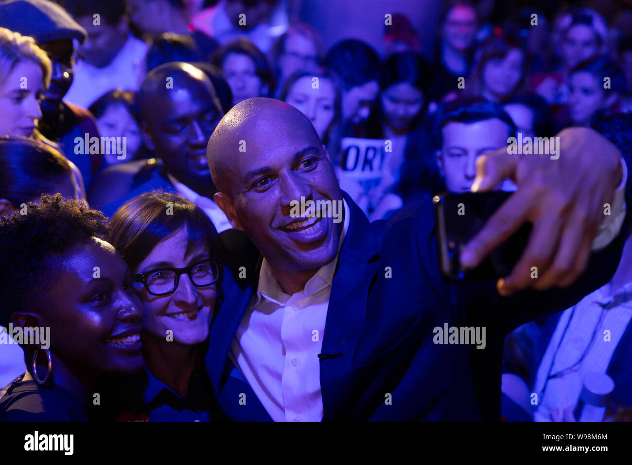 New York, NY - August 12, 2019: Democratic presidential candidate US Senator Cory Booker poses for photos with supporters at campaign grassroots Happy Hour fundraiser event at the nightclub Slate Stock Photo