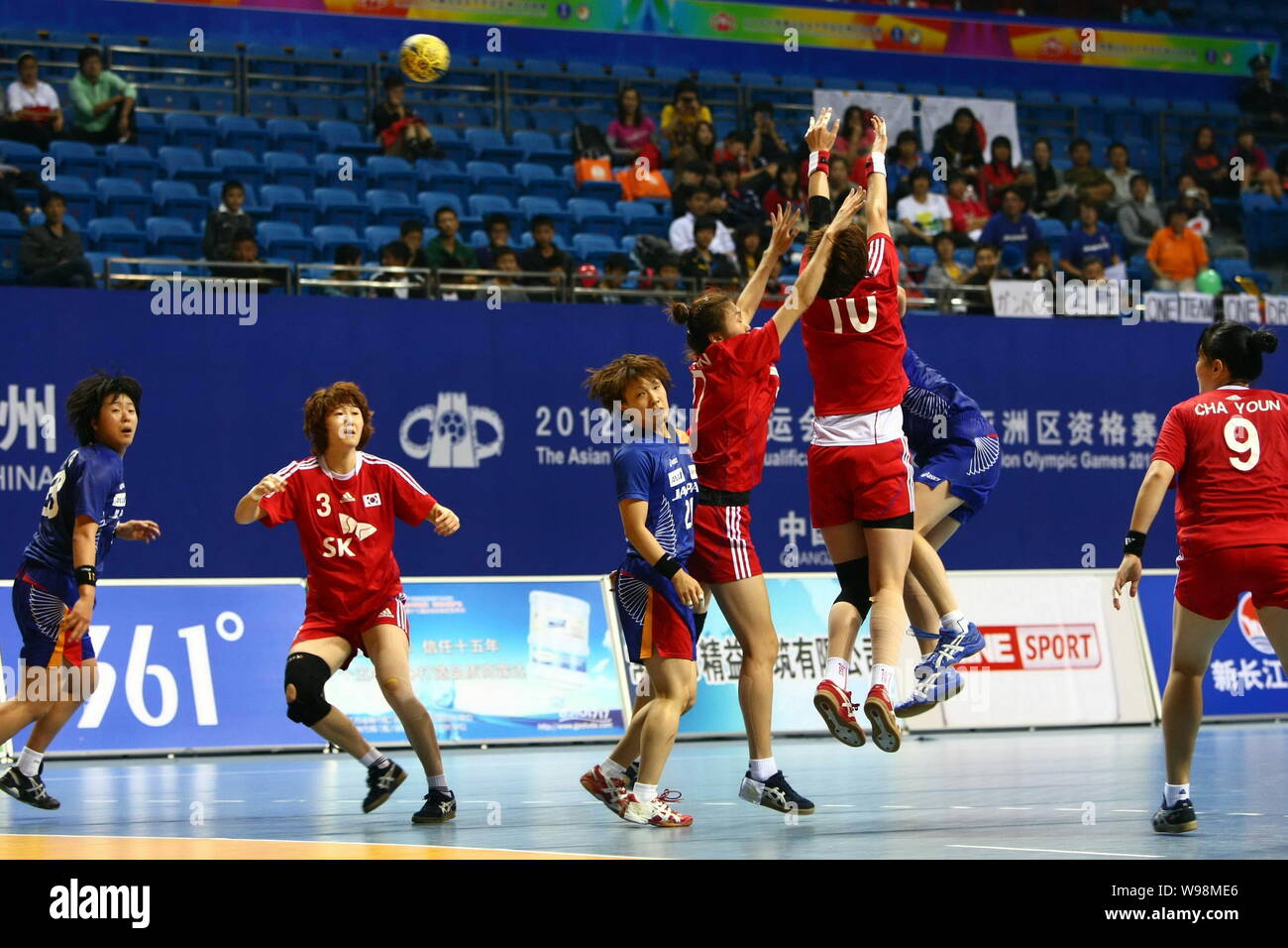 Players of Japan (Blue) and players of South Korea compete in a match