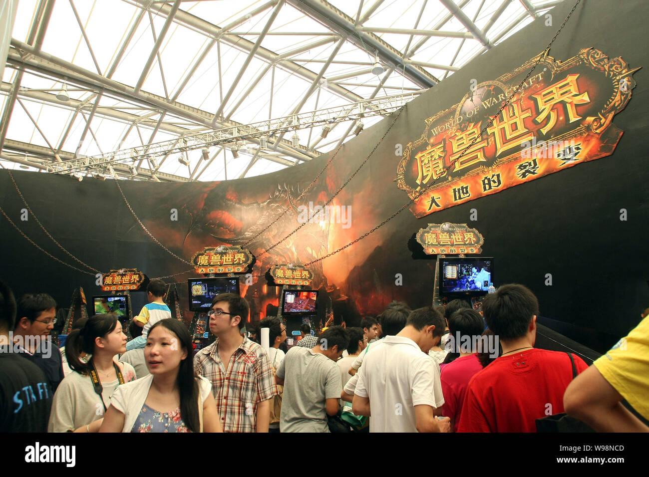 Visitors crowd the booth of World of Warcraft during the 9th China Digital Entertainment Expo & Conference, also known as ChinaJoy 2011, in Shanghai N Stock Photo